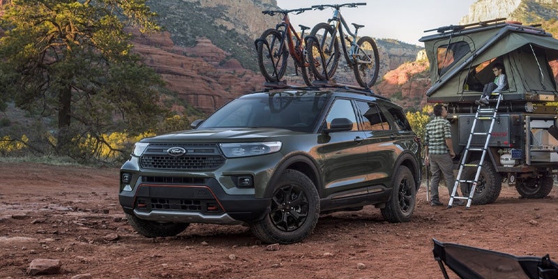 Ford Explorer Towing a Trailer on Scenic Road