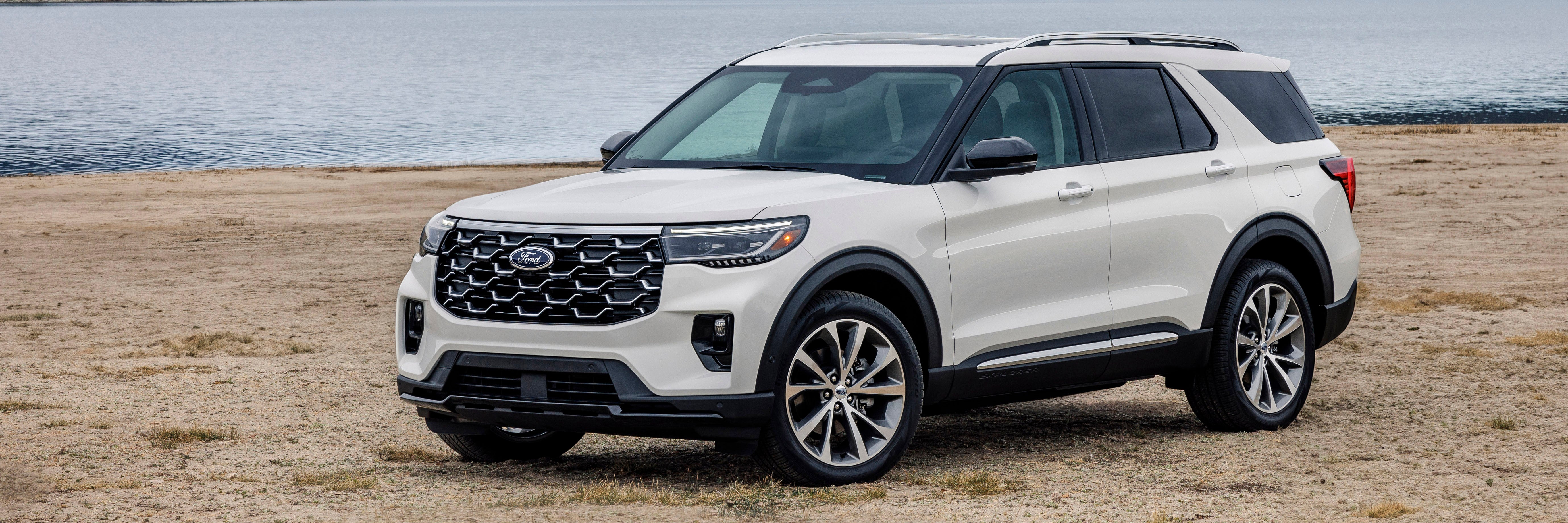 2025 Ford Explorer Platinum facing a 2024 Toyota Highlander on the road
